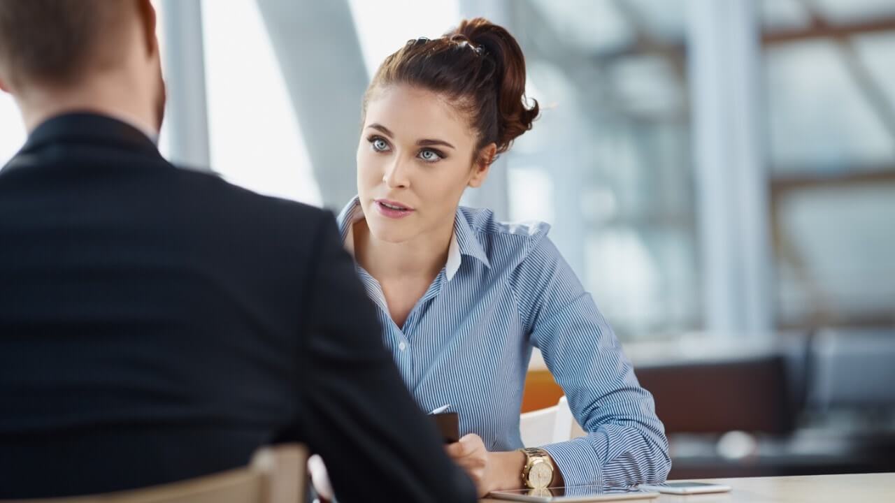 Woman listening intently to a customer
