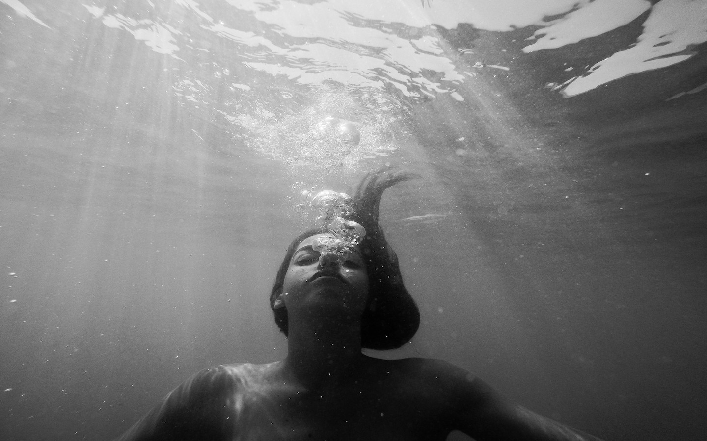 Woman drowning under water